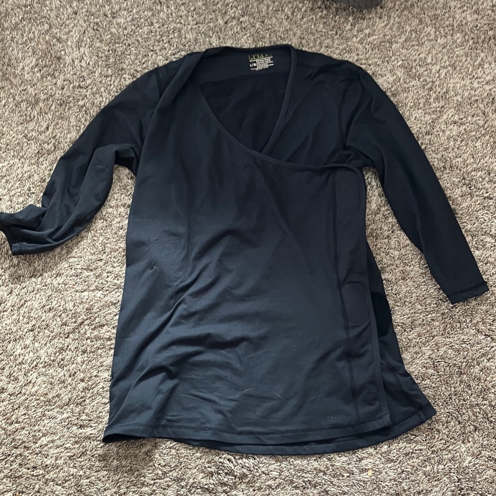 Nuroo baby wearing 3/4 length sleeve shirt